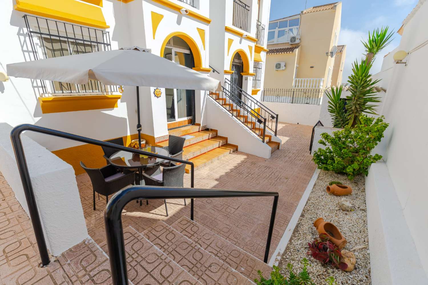 Ground floor bungalow with communal pool