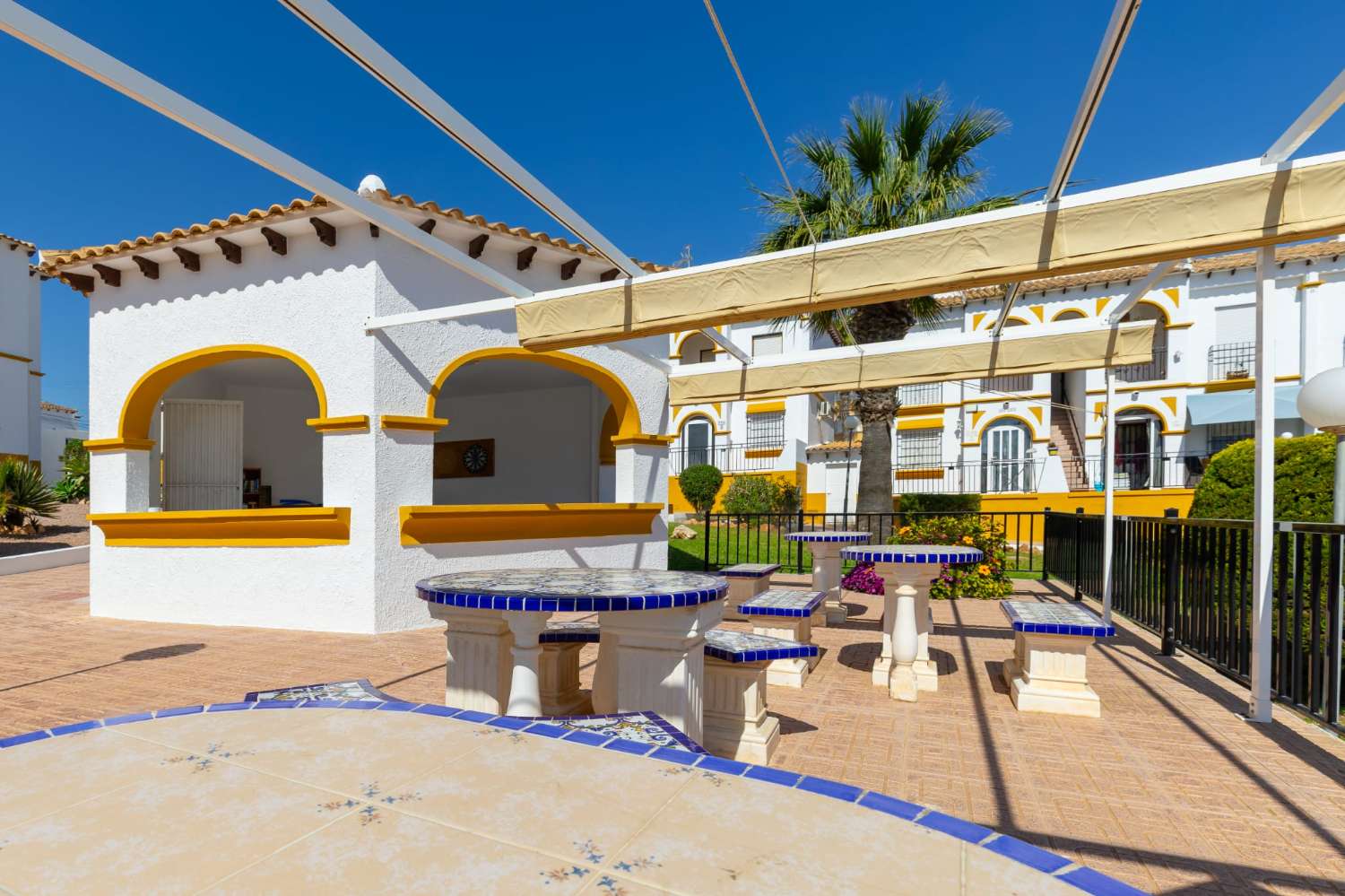 Ground floor bungalow with communal pool