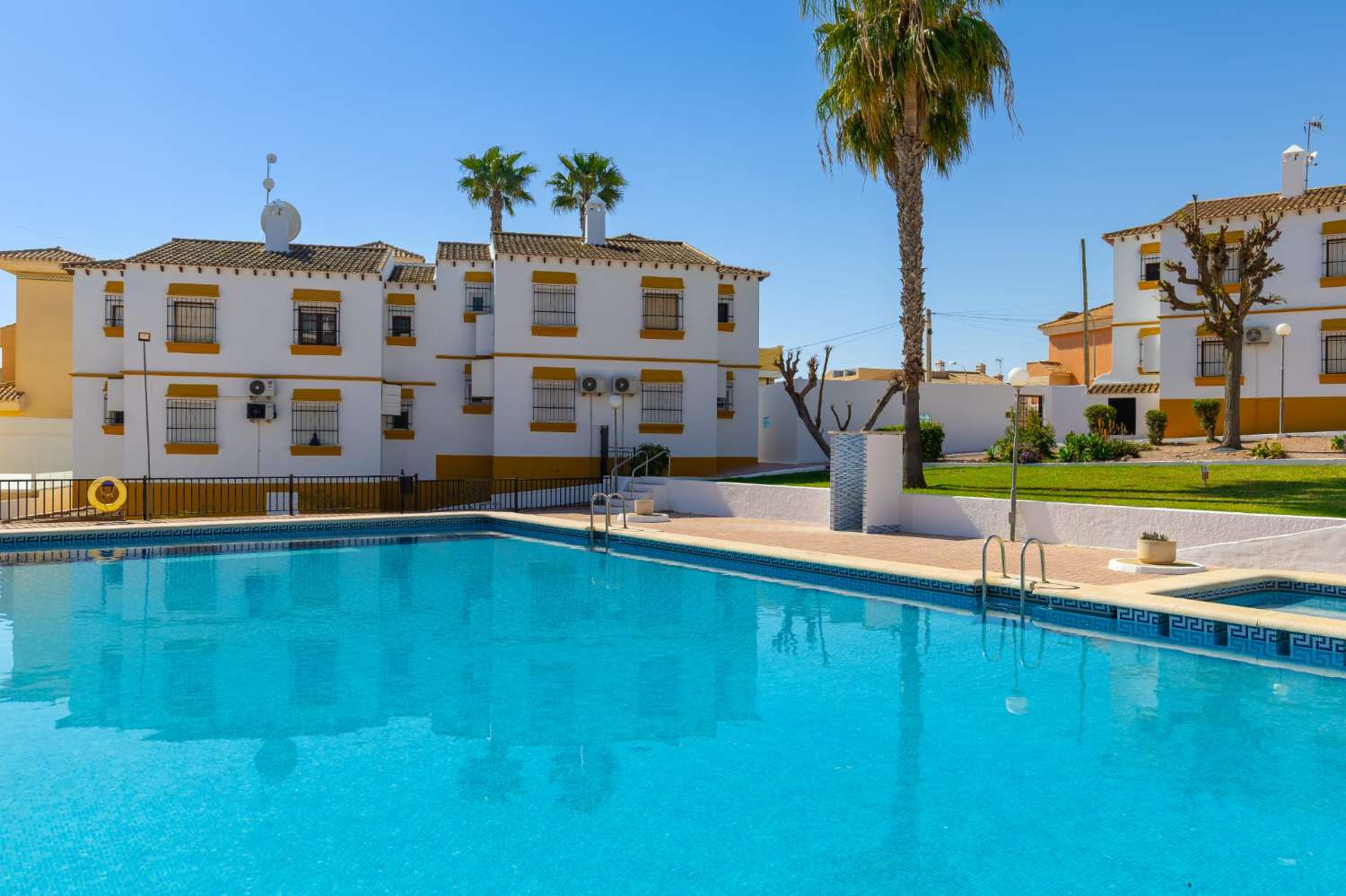 Ground floor bungalow with communal pool