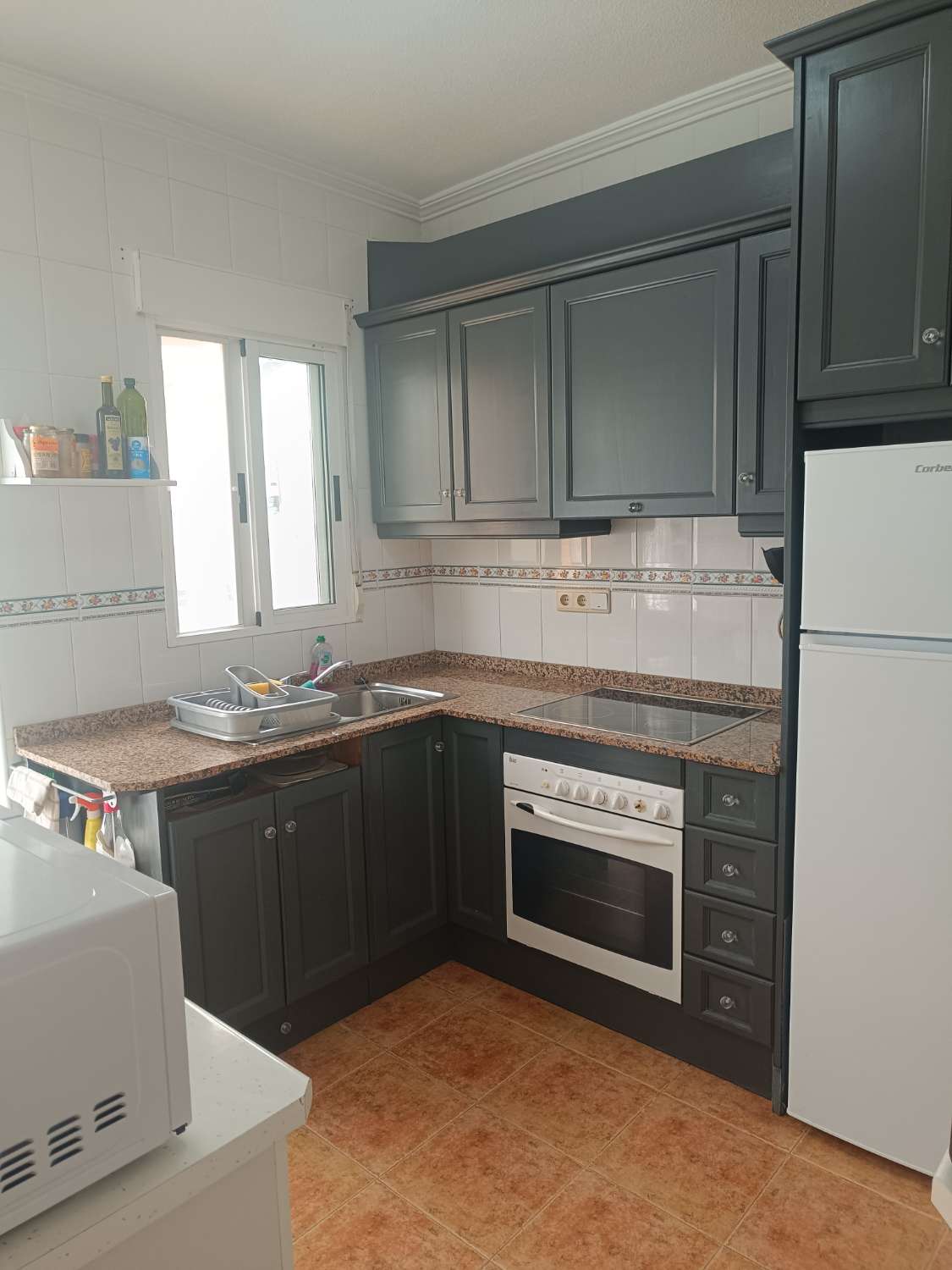 Vendu/Superbe maison de ville rénovée avec garage et solarium à Punta Prima
