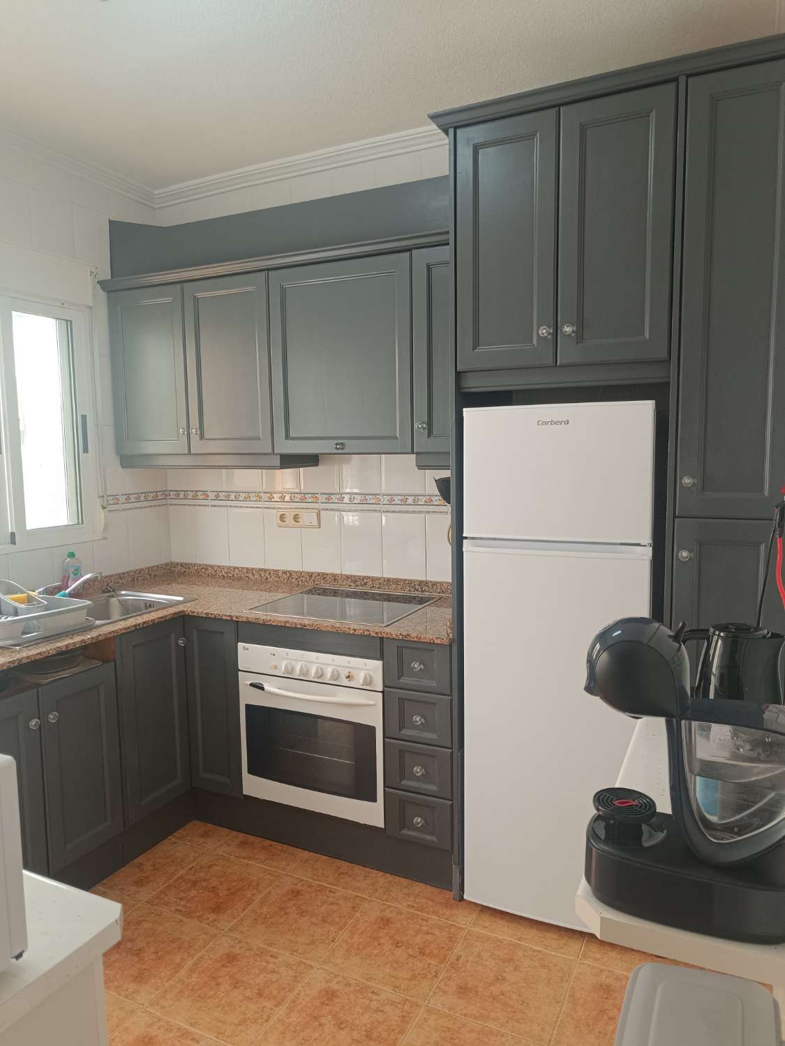 Vendu/Superbe maison de ville rénovée avec garage et solarium à Punta Prima